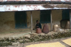 A man making bambu baskets